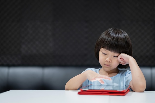 kid watching tablet child addicted cartoon