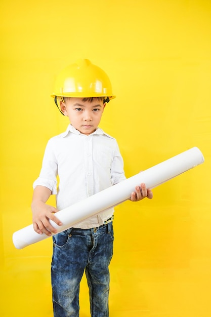 A kid wearing an engineer uniform portraying as a professional\
contractor