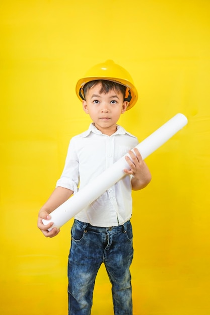 A kid wearing an engineer uniform portraying as a professional
contractor