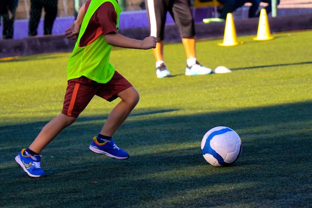 Kid with the ball at the feets