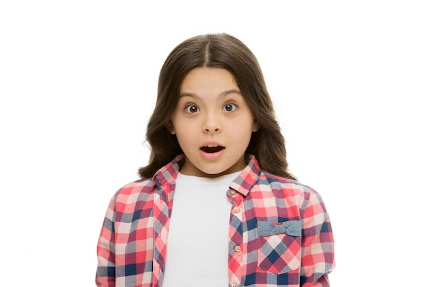 Kid with shocked look isolated on white Girl with long brunette hair Little child in casual style Beauty salon Shocking news