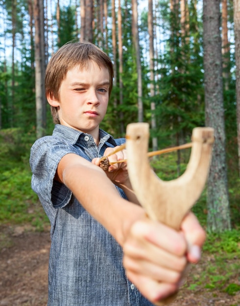 Kid with slingshot