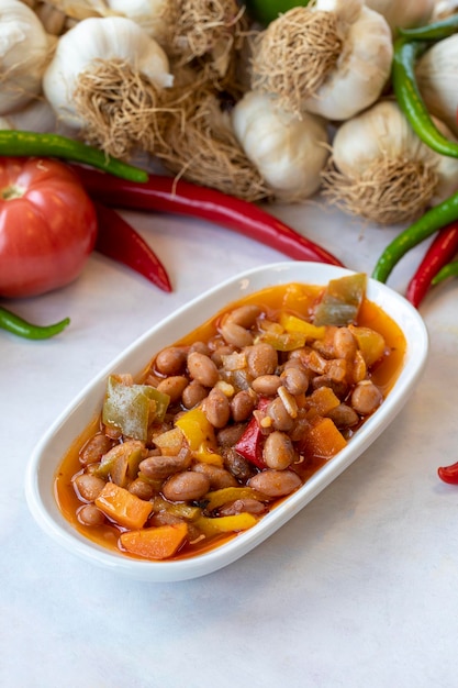 Kidney bean appetizer traditional turkish and arabic cuisine\
meze snack meal served alongside the main course natural vegetarian\
food barbunya plaki chili beans