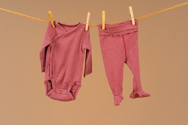 Kids apparel pinned to a clothesline to dry