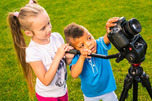 Kids are holding a camera.