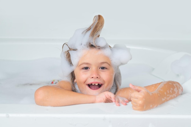 Kids bath kid bathes in a bath with foam