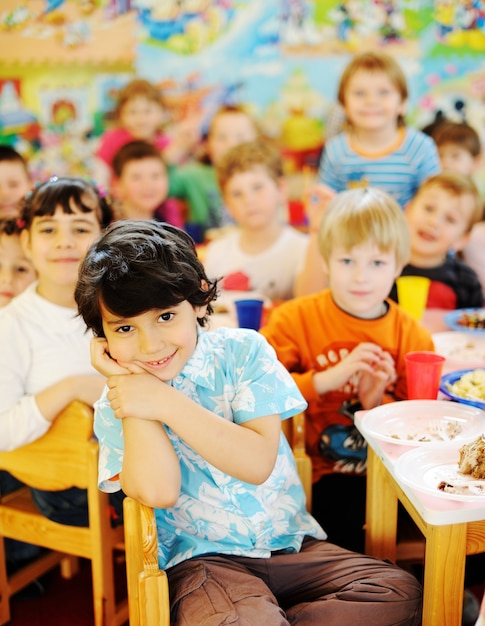 Kids celebrating birthday party in kindergarden playground