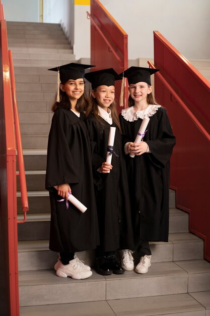 Kids celebrating kindergarten graduation