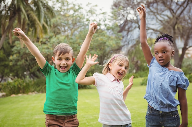 Kids celebrating with arms raised