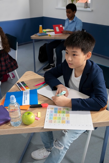 Kids in classroom taking english class