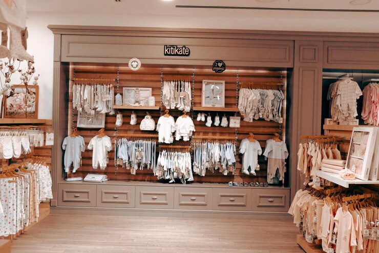kids clothes hanging on the shelf in the store