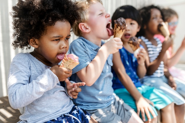 Kids eating ice cream in the summer