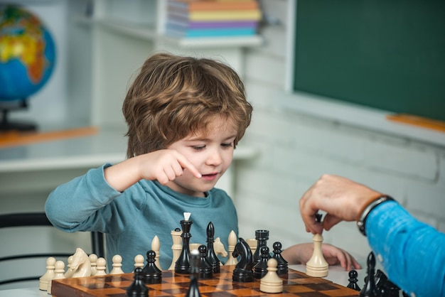 Kids educational games early development boy kid playing chess at home games and activities for chil