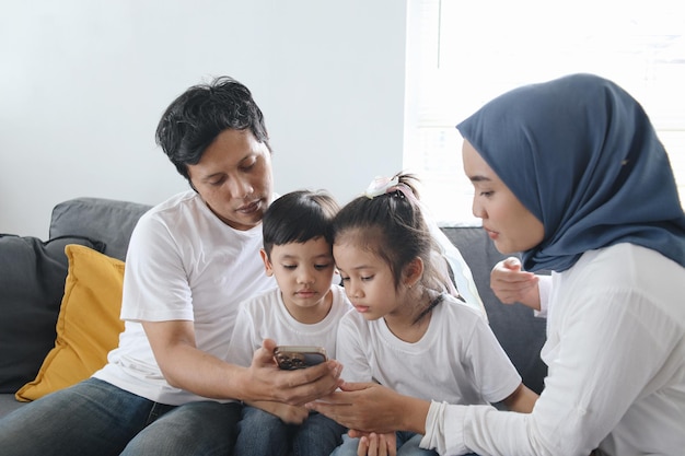 Kids Excited Watching Smartphone with Parents Parental Control for Gadget Addiction