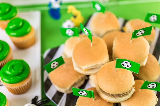 Kids football party set with snacks and drinks.