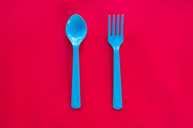 Kids funny eating. Composition of Colorful cutlery