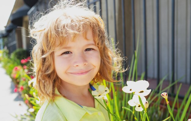 Kids funny face Happy kid having fun and making faces outdoors Childrens day