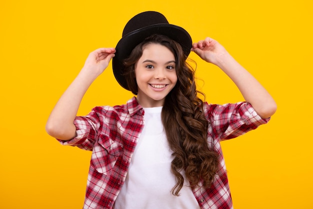 Kids girl in old fashion clothes Elegent hat cylinder hat isolated on yellow background Headwear Clothes accessories Fashion headwear for gentlemen in vintage style old classic cylinder