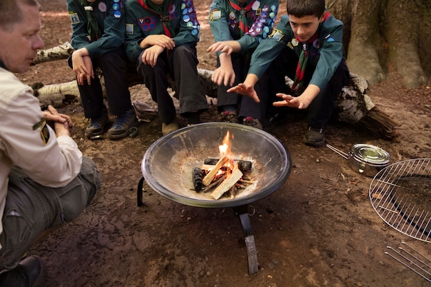 Photo kids having fun as boy scouts