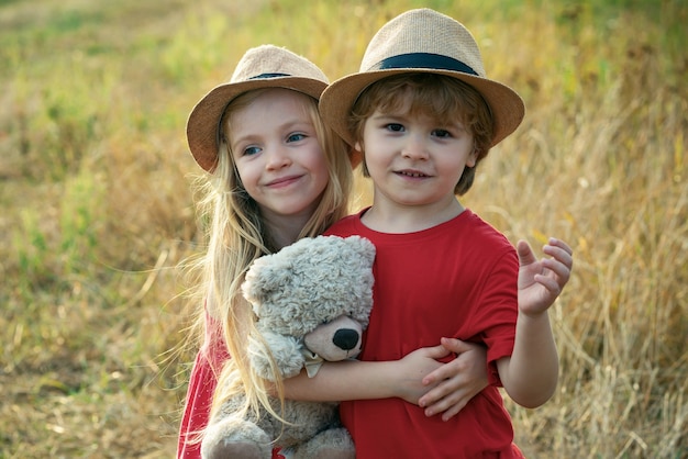 Kids having fun in autumn field.