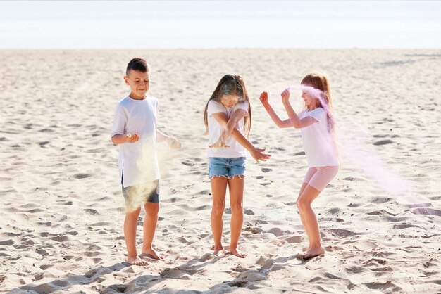 Kids having fun by playing with colored powder