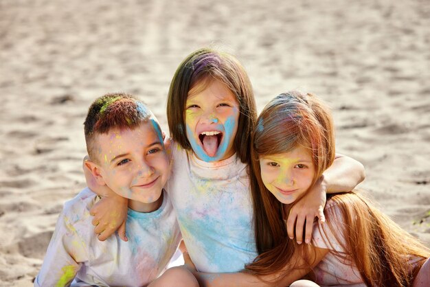 Kids having fun by playing with colored powder