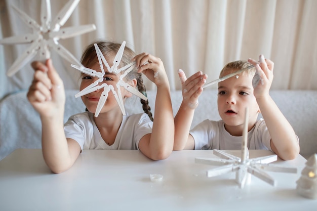 Kids make christmas snowflakes from clothespin reusable original ornament diy new year decoration