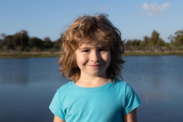 Kids outdoor portrait close up head of cute child