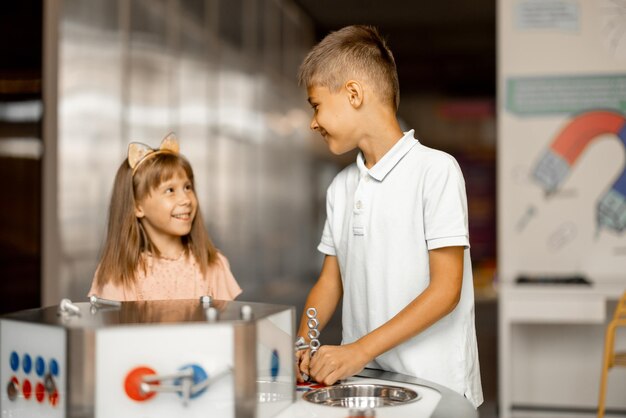 Kids play with magnets in science museum