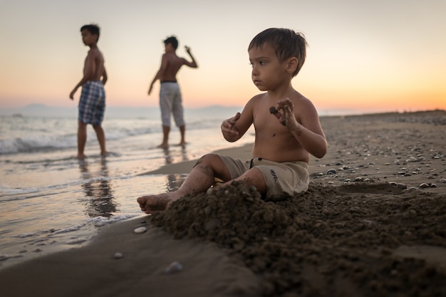 Kids playing in beach sand