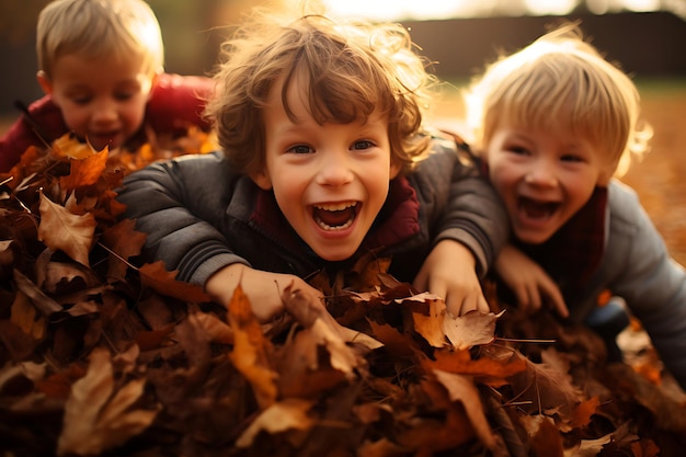 Kids playing in a pile of fallen leaves