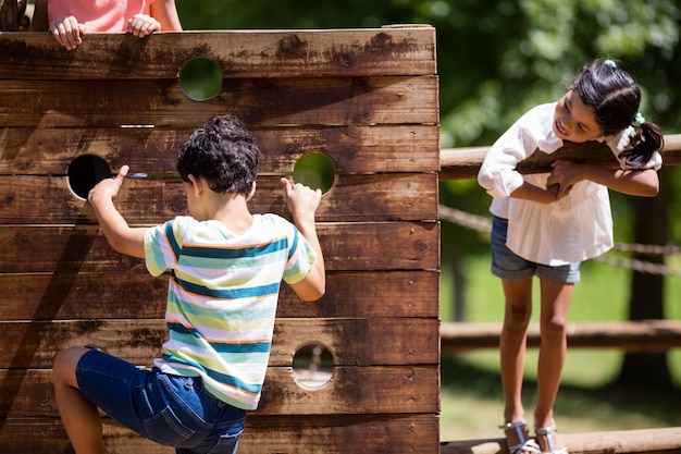 Kids playing on a playground ride in park