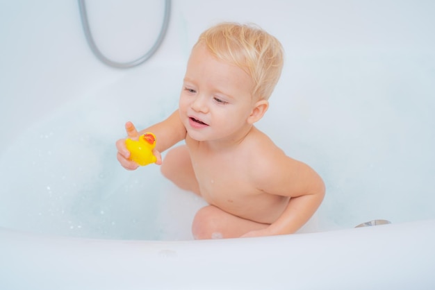 Kids playing in tub wash infant hygiene and health and skin care childs hygiene bath toy duck bubble