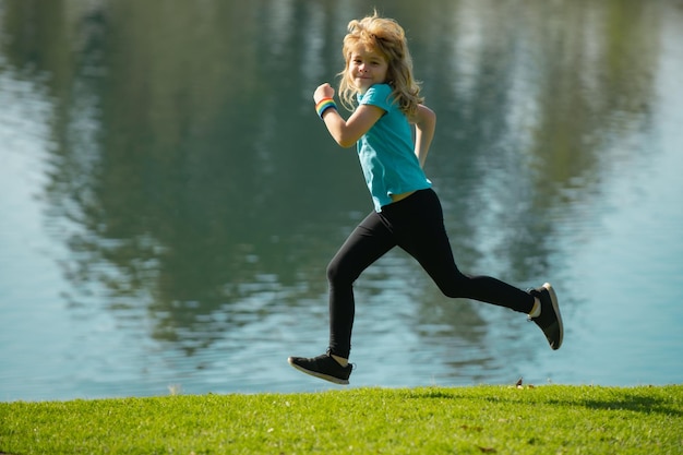 Kids running outdoors Child runner jogger running in the nature Morning jogging