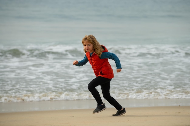 Kids running outdoors run and healthy sport for children child running near sea kids fitness little