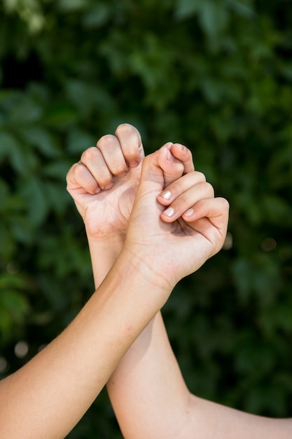 Kids shaking hands outdoors