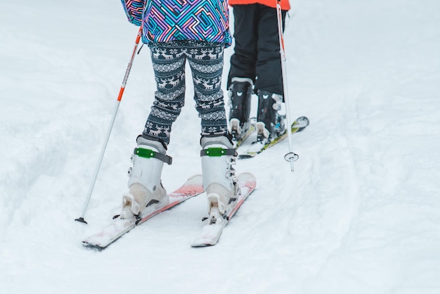 Kids skiing in snowed city park. childhood lifestyle