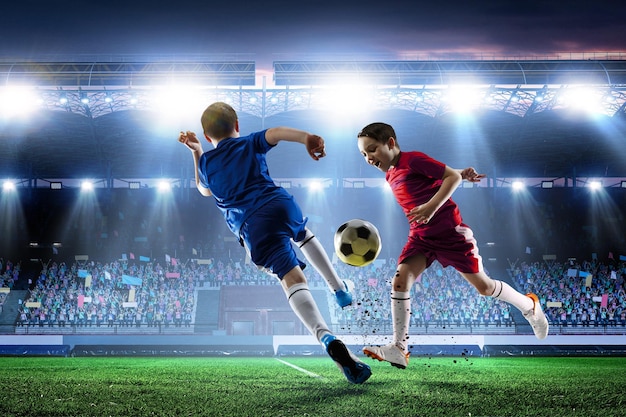 Photo kids on a soccer stadium. mixed media