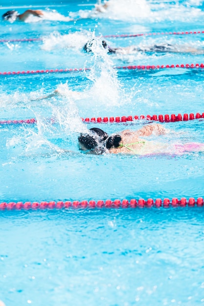 Kids swim meet in outdoor pool during the summer.