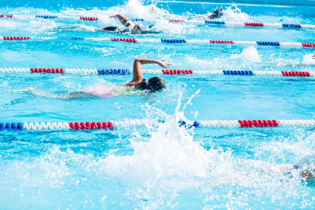 Kids swim meet in outdoor pool during the summer.