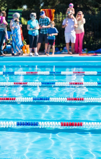 Kids swim meet in outdoor pool during the summer.