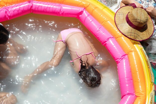 Kids swimming in the inflatable pool