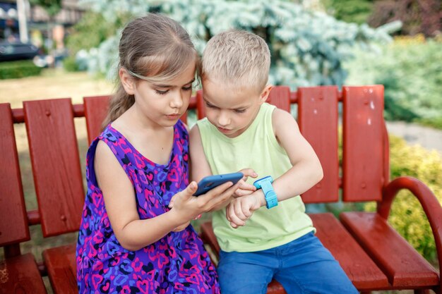 Kids using smartwatches with interest care and parents control new technology for children