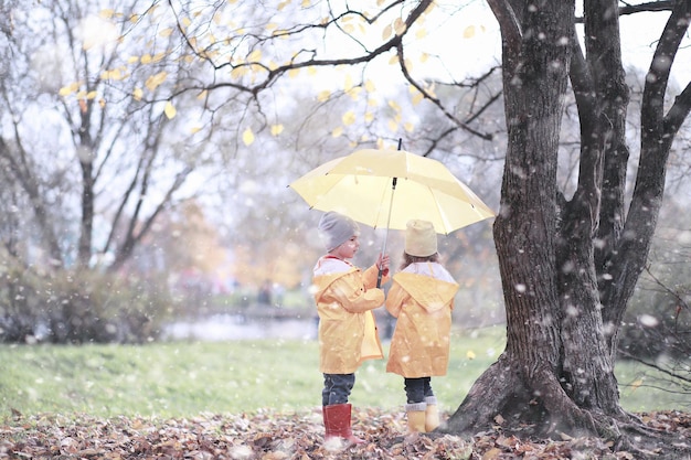 Kids walk in the park with first snow