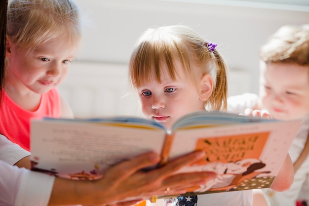 Kids watching book together