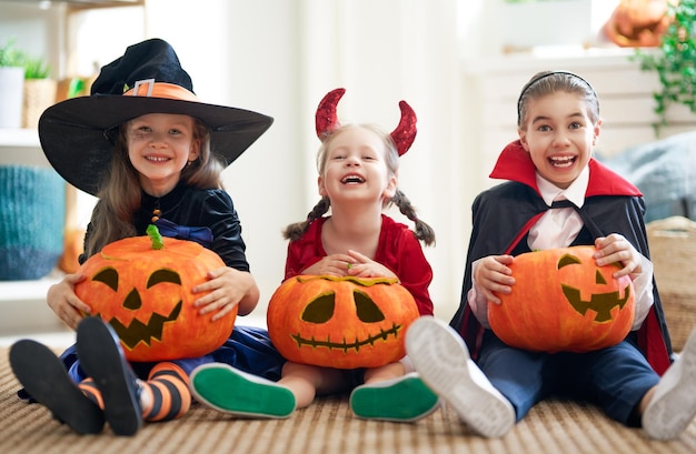 Kids with carving pumpkin