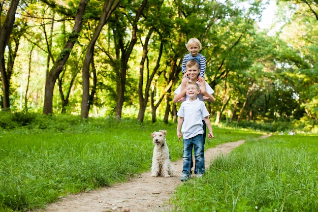 Kids with fox terrier dog