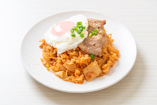 Kimchi fried rice with fried egg and pork - Korean food style