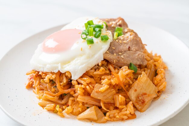 Kimchi fried rice with fried egg and pork - Korean food style