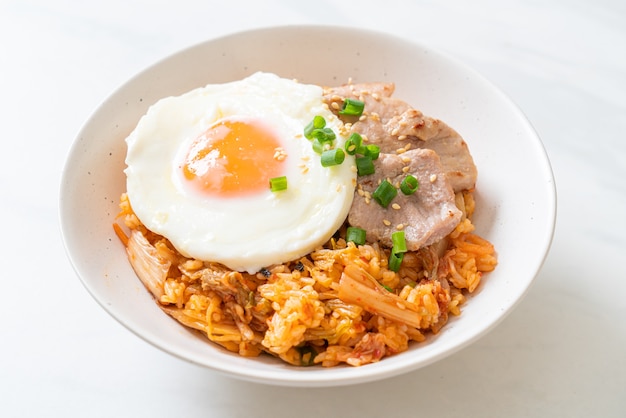 Kimchi fried rice with fried egg and pork - Korean food style